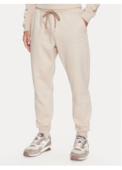 Columbia Spodnie dresowe Marble Canyon™ Heavyweight Fleece Pant Brązowy Regular Fit ze sklepu MODIVO w kategorii Spodnie męskie - zdjęcie 168652993