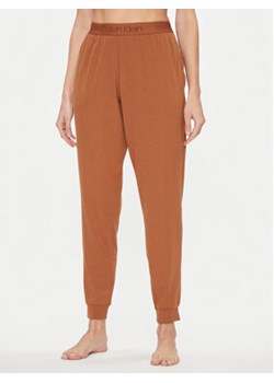 Calvin Klein Underwear Spodnie piżamowe 000QS7004E Brązowy Regular Fit ze sklepu MODIVO w kategorii Piżamy damskie - zdjęcie 168665531