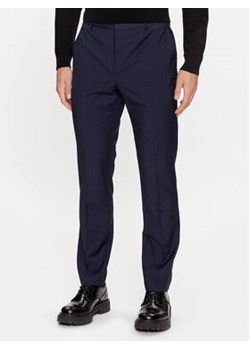 Calvin Klein Spodnie garniturowe K10K111722 Granatowy Slim Fit ze sklepu MODIVO w kategorii Spodnie męskie - zdjęcie 168670114