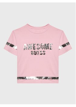 Guess T-Shirt J3RI19 K6YW1 Różowy Regular Fit ze sklepu MODIVO w kategorii Bluzki dziewczęce - zdjęcie 168671522