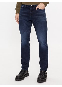 Tommy Jeans Jeansy Scanton DM0DM17438 Granatowy Slim Fit ze sklepu MODIVO w kategorii Jeansy męskie - zdjęcie 168679342