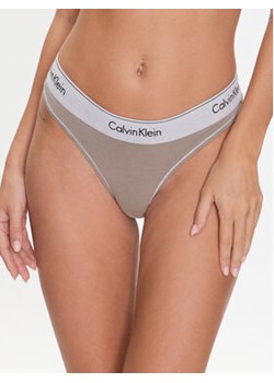 Calvin Klein Underwear Stringi 000QF7208E Beżowy ze sklepu MODIVO w kategorii Majtki damskie - zdjęcie 168679872