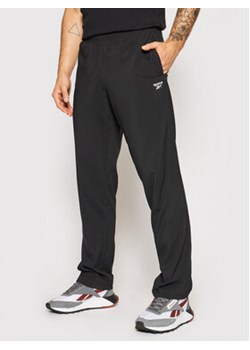 Reebok Spodnie dresowe Training Essentials Woven FP9170 Czarny Regular Fit ze sklepu MODIVO w kategorii Spodnie męskie - zdjęcie 168680360