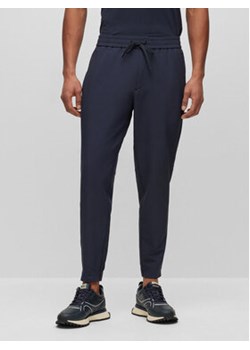 Boss Spodnie dresowe T_Flex 50495491 Granatowy Tapered Fit ze sklepu MODIVO w kategorii Spodnie męskie - zdjęcie 168681221