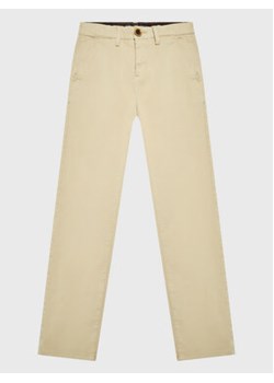 Guess Chinosy L1BB03 WDD52 Beżowy Regular Fit ze sklepu MODIVO w kategorii Spodnie chłopięce - zdjęcie 168682784