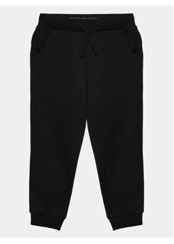 Guess Spodnie dresowe N93Q17 KAUG0 Czarny Regular Fit ze sklepu MODIVO w kategorii Spodnie i półśpiochy - zdjęcie 168685964