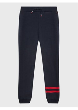 Tommy Hilfiger Spodnie dresowe Th Collegiate KB0KB07983 D Granatowy Regular Fit ze sklepu MODIVO w kategorii Spodnie chłopięce - zdjęcie 168687542