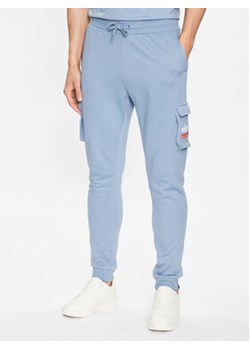Ellesse Spodnie dresowe Labico SHR17718 Niebieski Regular Fit ze sklepu MODIVO w kategorii Spodnie męskie - zdjęcie 168693572