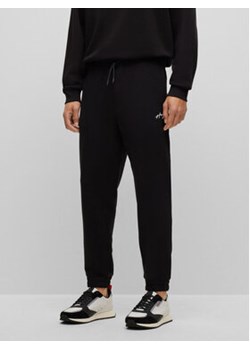Hugo Spodnie dresowe Drasilia 50486457 Czarny Relaxed Fit ze sklepu MODIVO w kategorii Spodnie męskie - zdjęcie 168734554