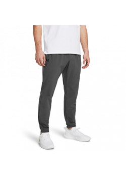 Męskie spodnie treningowe Under Armour UA Stretch Woven Joggers - szare ze sklepu Sportstylestory.com w kategorii Spodnie męskie - zdjęcie 168823581