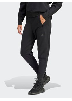 adidas Spodnie dresowe Z.N.E. Winterized IN9476 Czarny Regular Fit ze sklepu MODIVO w kategorii Spodnie damskie - zdjęcie 168838591