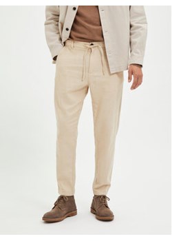 Selected Homme Chinosy 16087636 Beżowy Slim Tapered Fit ze sklepu MODIVO w kategorii Spodnie męskie - zdjęcie 168840171