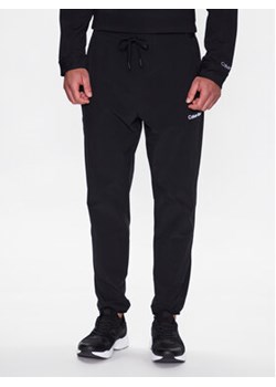 Calvin Klein Performance Spodnie dresowe 00GMS3P600 Czarny Regular Fit ze sklepu MODIVO w kategorii Spodnie męskie - zdjęcie 168928831