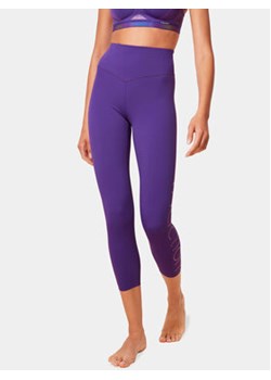 Triumph Legginsy Cardio RTW 7/8 High Waist Leggings Logo 10215957 Fioletowy Slim Fit ze sklepu MODIVO w kategorii Spodnie damskie - zdjęcie 168960230