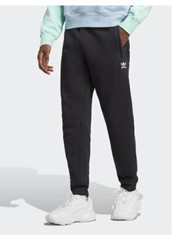 adidas Spodnie dresowe Trefoil Essentials Joggers IA4837 Czarny Slim Fit ze sklepu MODIVO w kategorii Spodnie męskie - zdjęcie 169181034