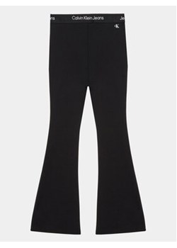 Calvin Klein Jeans Spodnie materiałowe Punto Tape Flare IG0IG02097 Czarny Slim Fit ze sklepu MODIVO w kategorii Spodnie dziewczęce - zdjęcie 169204090