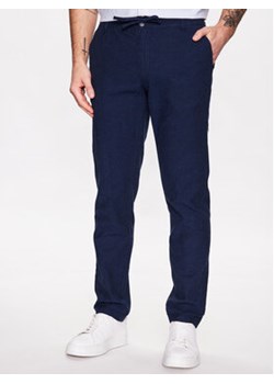 Lindbergh Spodnie materiałowe 30-008003 Niebieski Tapered Fit ze sklepu MODIVO w kategorii Spodnie męskie - zdjęcie 169288143