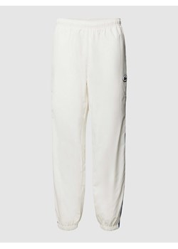 Spodnie dresowe o kroju regular fit z naszwyką z logo ze sklepu Peek&Cloppenburg  w kategorii Spodnie męskie - zdjęcie 169330914