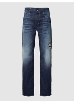 Jeansy o kroju slim fit z przetarciami ze sklepu Peek&Cloppenburg  w kategorii Jeansy męskie - zdjęcie 169331010