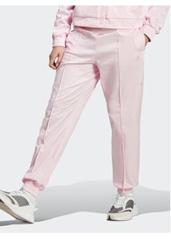 adidas Spodnie dresowe Loose Trousers with Healing Crystals-Inspired Graphics IC0795 Różowy Loose Fit ze sklepu MODIVO w kategorii Spodnie damskie - zdjęcie 169341663