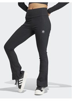 adidas Spodnie materiałowe Essentials II8056 Czarny Flare Fit ze sklepu MODIVO w kategorii Spodnie damskie - zdjęcie 169417942