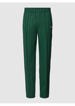 Spodnie dresowe o kroju regular fit z graficznym wzorem na całej powierzchni ze sklepu Peek&Cloppenburg  w kategorii Spodnie męskie - zdjęcie 169459722