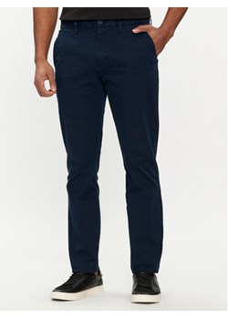 Tommy Jeans Chinosy Austin DM0DM19166 Granatowy Slim Fit ze sklepu MODIVO w kategorii Spodnie męskie - zdjęcie 169491461