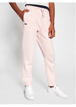 Lacoste Spodnie dresowe XJ9476 Różowy Regular Fit ze sklepu MODIVO w kategorii Spodnie dziewczęce - zdjęcie 169491860