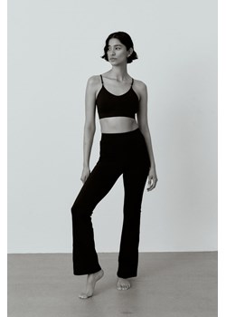H & M - Rozszerzane spodnie sportowe DryMove - Czarny ze sklepu H&M w kategorii Spodnie damskie - zdjęcie 169598233
