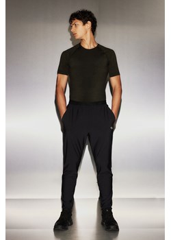H & M - Spodnie z czterokierunkowym stretchem DryMove - Czarny ze sklepu H&M w kategorii Spodnie męskie - zdjęcie 169599223