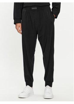 Calvin Klein Underwear Spodnie dresowe 000NM2571E Czarny Regular Fit ze sklepu MODIVO w kategorii Spodnie męskie - zdjęcie 169658242