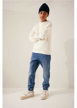 H & M - Dżinsowe joggersy Comfort Stretch - Niebieski ze sklepu H&M w kategorii Spodnie chłopięce - zdjęcie 169676863