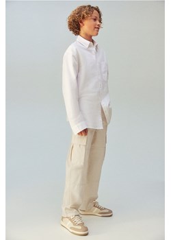 H & M - Bawełniane spodnie cargo - Beżowy ze sklepu H&M w kategorii Spodnie chłopięce - zdjęcie 169677544