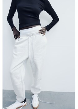 H & M - Spodnie dresowe z domieszką bawełny - Szary ze sklepu H&M w kategorii Spodnie damskie - zdjęcie 169677762