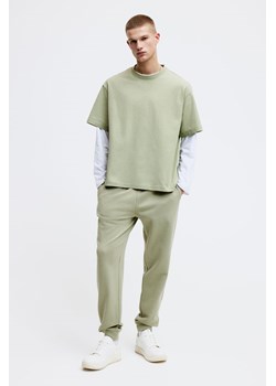 H & M - Spodnie dresowe Regular Fit - Zielony ze sklepu H&M w kategorii Spodnie męskie - zdjęcie 169679010
