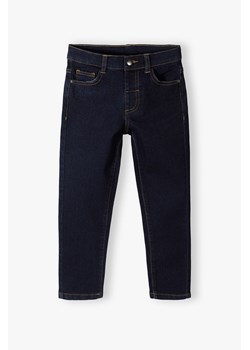 Granatowe spodnie jeansowe slim dla chłopca - 5.10.15. ze sklepu 5.10.15 w kategorii Spodnie chłopięce - zdjęcie 169687922