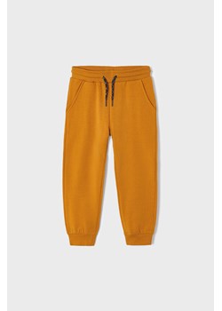 Pomarańczowe spodnie dresowe chłopięce ze sklepu 5.10.15 w kategorii Spodnie chłopięce - zdjęcie 169692933