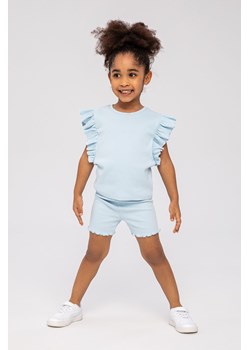Dziewczęca bluzka z krótkim rękawem i falbanką- błękitna ze sklepu 5.10.15 w kategorii Bluzki dziewczęce - zdjęcie 169696090