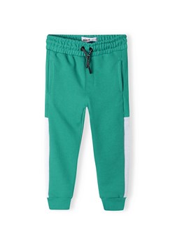 Zielone spodnie dresowe niemowlęce z białymi paskami ze sklepu 5.10.15 w kategorii Spodnie i półśpiochy - zdjęcie 169711753