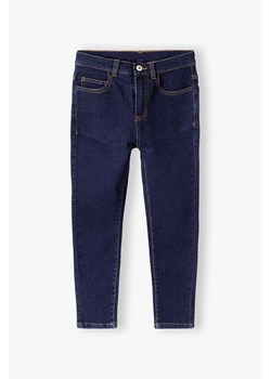 Granatowe jeansowe spodnie slim dla chłopca ze sklepu 5.10.15 w kategorii Spodnie chłopięce - zdjęcie 169711791