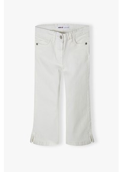 Białe spodnie jeansowe dziewczęce rozkloszowane ze sklepu 5.10.15 w kategorii Spodnie dziewczęce - zdjęcie 169714761