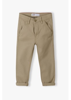 Beżowe spodnie chłopięce typu chinosy z bawełny ze sklepu 5.10.15 w kategorii Spodnie chłopięce - zdjęcie 169719753