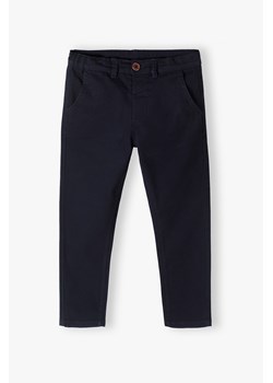 Granatowe eleganckie spodnie dla chłopca slim ze sklepu 5.10.15 w kategorii Spodnie chłopięce - zdjęcie 169719941