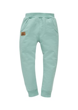 Luźne spodnie chłopięce z bawełny Let's rock zielone ze sklepu 5.10.15 w kategorii Spodnie chłopięce - zdjęcie 169725170