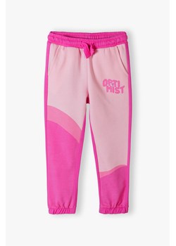 Spodnie dresowe dla dziewczynki OPTIMIST - różowe ze sklepu 5.10.15 w kategorii Spodnie dziewczęce - zdjęcie 169726773