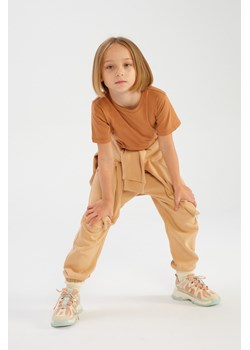 Beżowe spodnie dresowe dla dziecka - unisex - Limited Edition ze sklepu 5.10.15 w kategorii Spodnie chłopięce - zdjęcie 169749641
