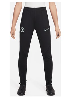 Dzianinowe spodnie piłkarskie dla dużych dzieci Nike Dri-FIT Chelsea F.C. Strike (wersja trzecia) - Czerń ze sklepu Nike poland w kategorii Spodnie chłopięce - zdjęcie 169754483