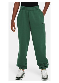 Dzianinowe spodnie o kroju oversize dla dużych dzieci (dziewcząt) Nike Sportswear - Zieleń ze sklepu Nike poland w kategorii Spodnie dziewczęce - zdjęcie 169755074