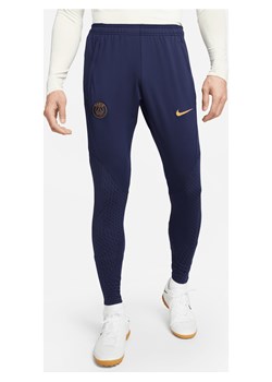 Męskie dzianinowe spodnie piłkarskie Paris Saint-Germain Strike Nike Dri-FIT - Niebieski ze sklepu Nike poland w kategorii Spodnie męskie - zdjęcie 169755783