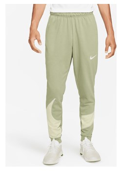 Męskie zwężane spodnie do fitnessu Nike Dri-FIT - Zieleń ze sklepu Nike poland w kategorii Spodnie męskie - zdjęcie 169756021